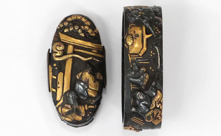 by Hikone Kanenori - Fuchi Kashira by Chieiko Nomura Kanenori, Sword Forging Scene on Shakudo Nanako Ground
